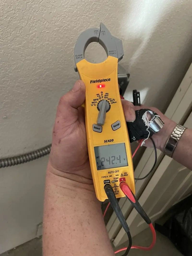 Voltage testing with clamp meter during Electrical Installation Services in Aventura